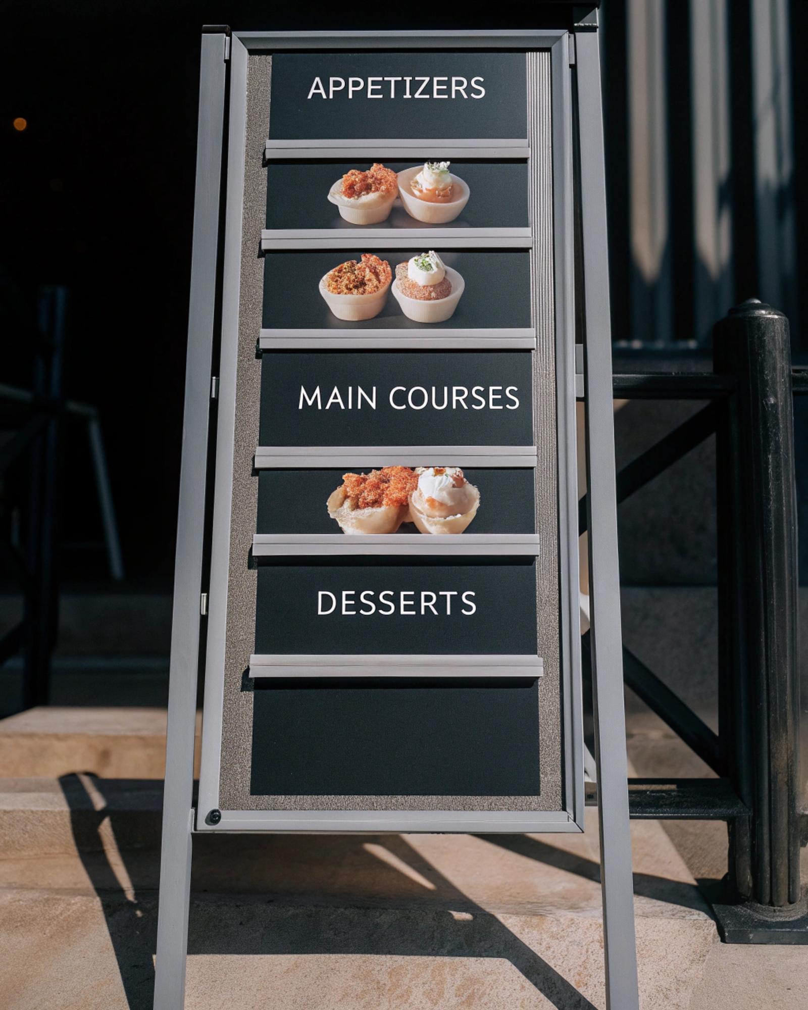 Exterior of small culinary studio with paper-like sign