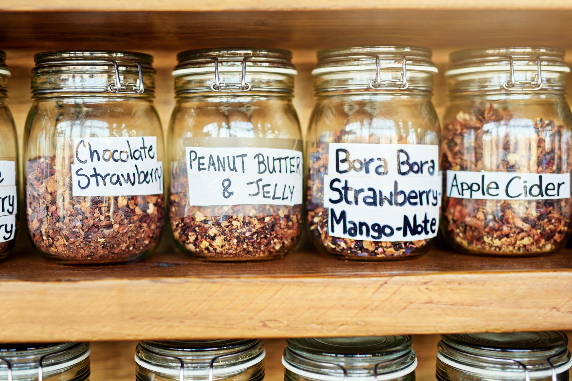 Close-up of labeled jars and ingredients
